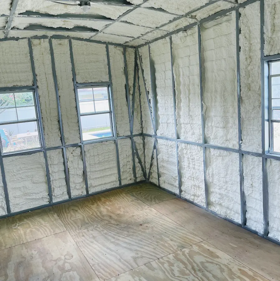 Closed-cell spray foam insulation applied to wall cavities in a residential project in Americus